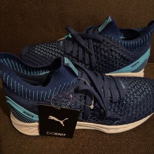 BRAND NEW WITH TAGS. Puma Blue and turquoise knit sneakers. Size 11.